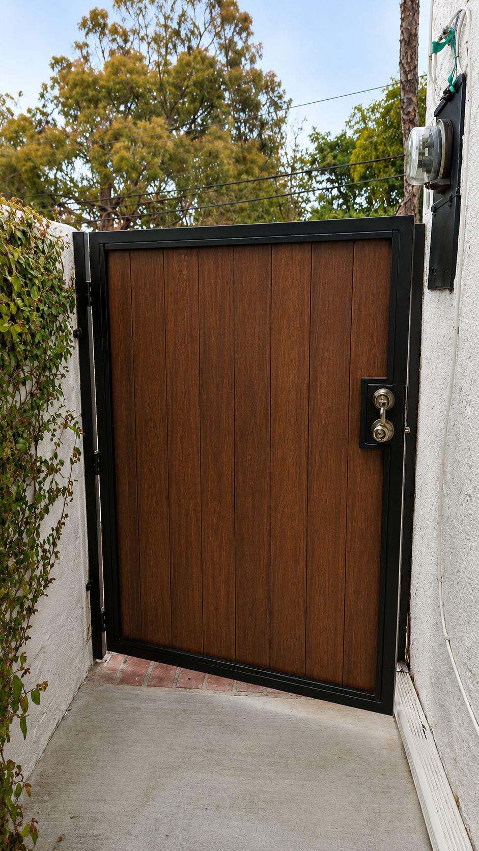Front view of custom composite and steel pedestrian gate with solid hardware in Glendale, Los Angeles - ProHands Handyman