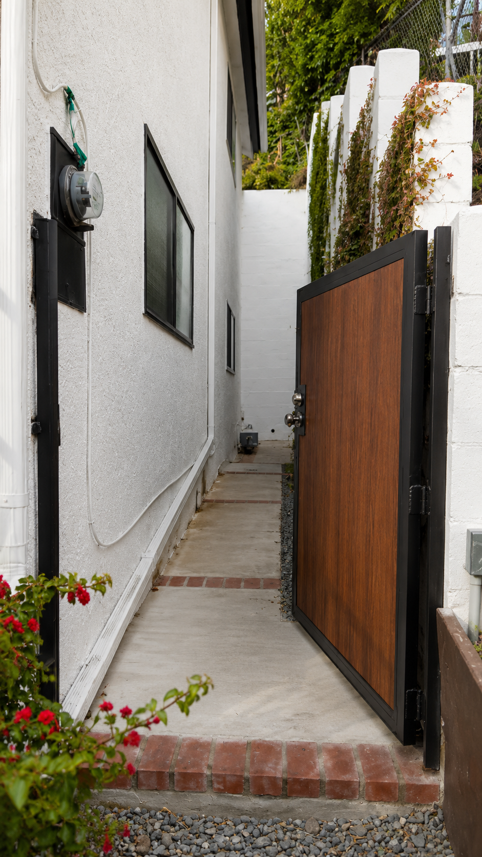 Custom composite pedestrian side yard gate with black steel frame in Los Angeles - ProHands Handyman