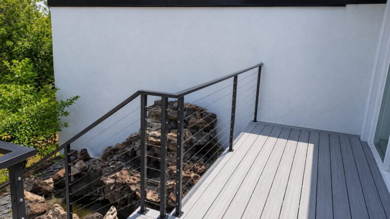 Cable deck railing stair transition with black posts in Los Angeles
