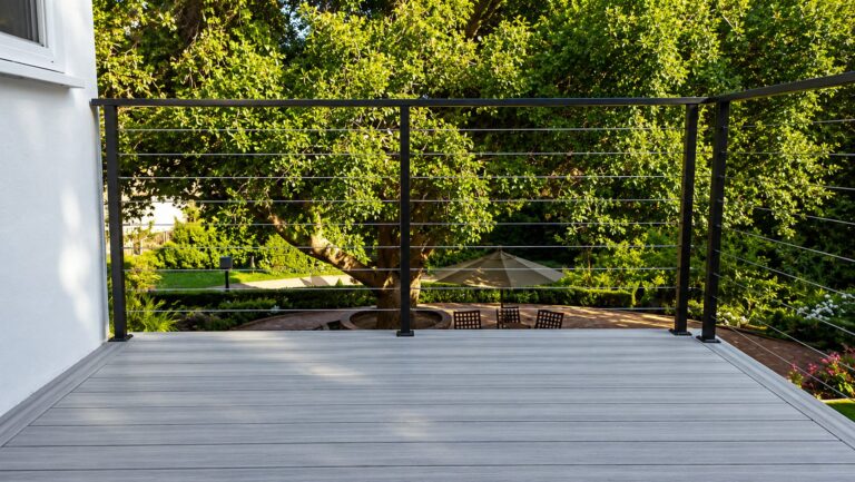 Black-frame cable railing on a gray composite deck in Los Angeles