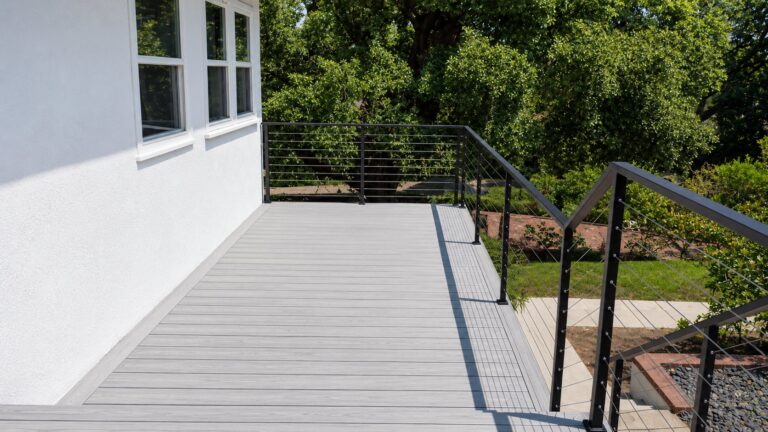 Gray composite deck with stainless cable railing in Los Angeles