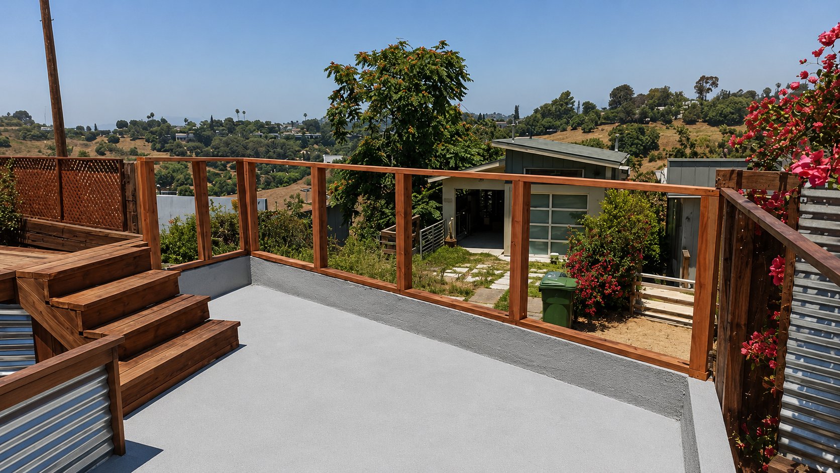 Cedar plank fence around hillside deck overlooking modern LA home and canyon view
