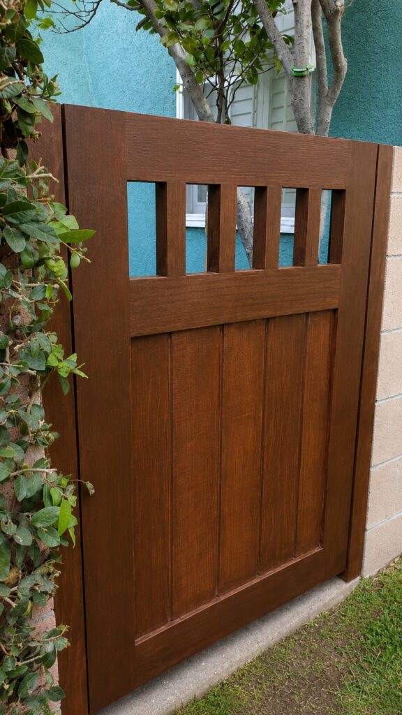 Medium-brown Craftsman wood side gate with open top slats in Los Angeles