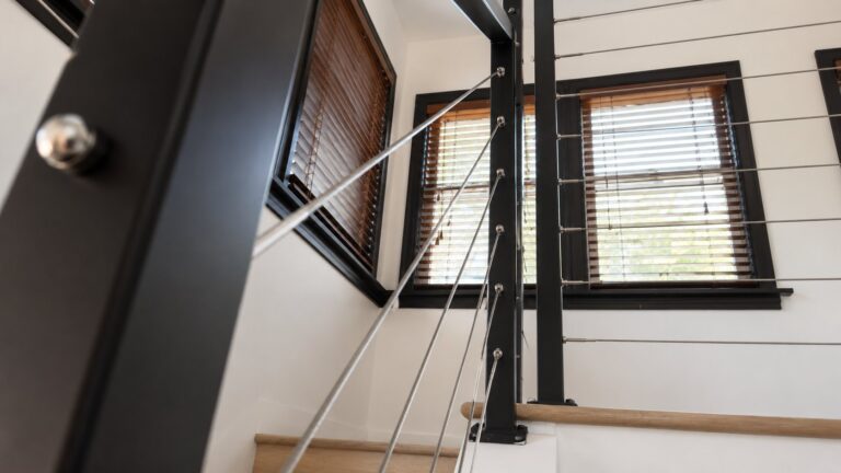 Angled stair rail with horizontal stainless cable, modern LA interior