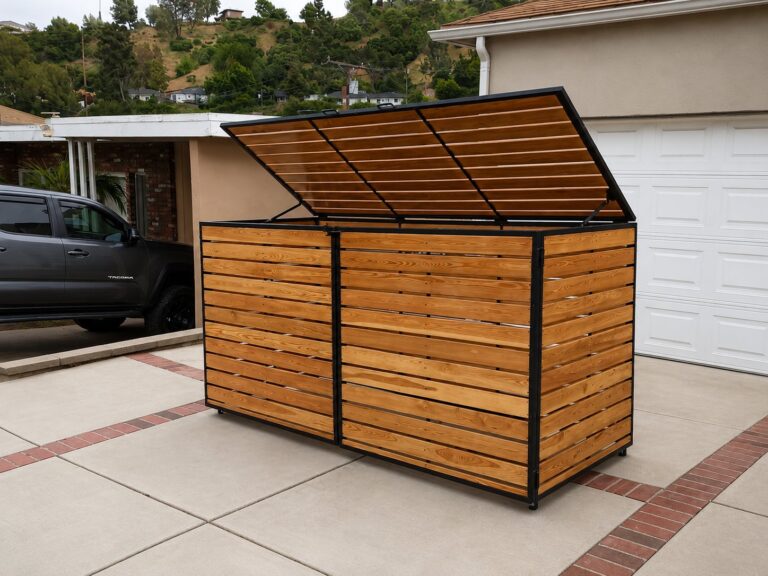 Steel-framed cedar trash enclosure with hinged lift-up lid in LA