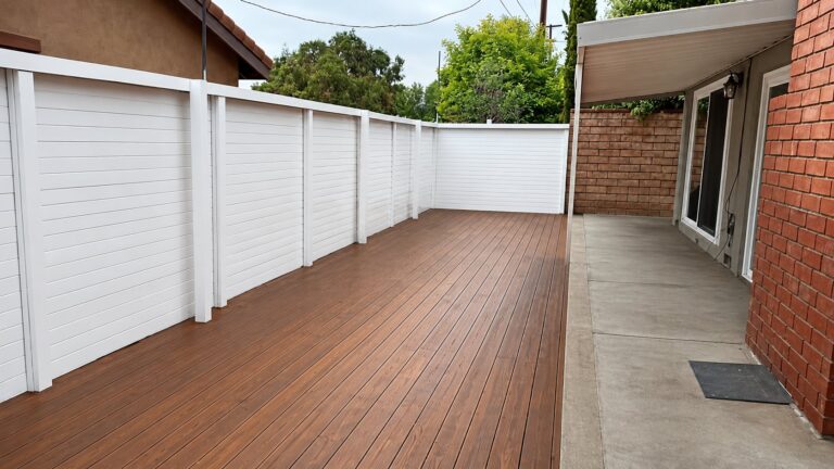 Custom wood deck with white horizontal privacy fence in La Crescenta, Los Angeles