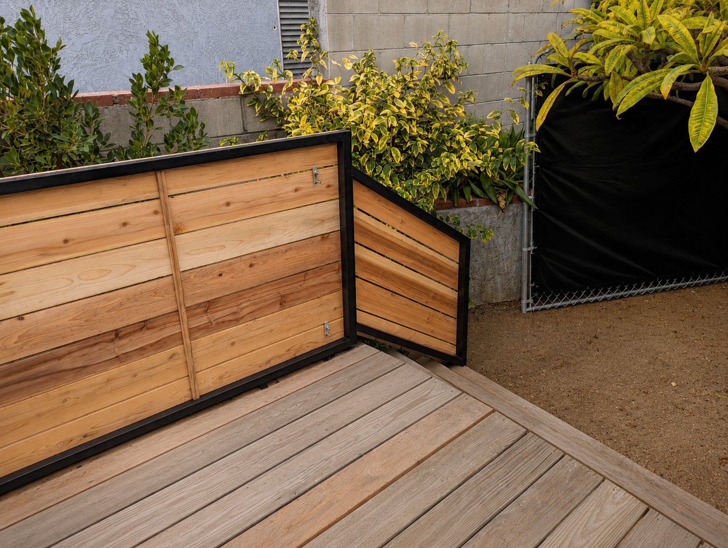 Built-in cedar planter boxes integrated into the steel frame — Los Angeles