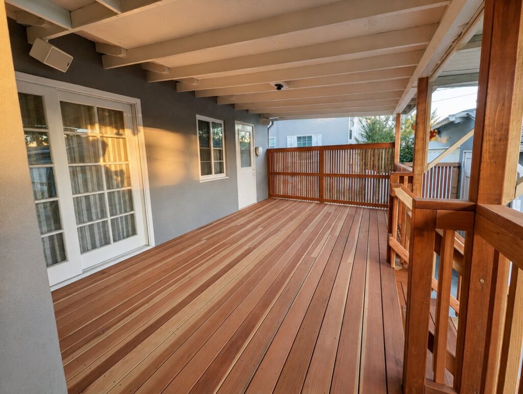 Covered redwood deck looking back toward French doors — Los Angeles