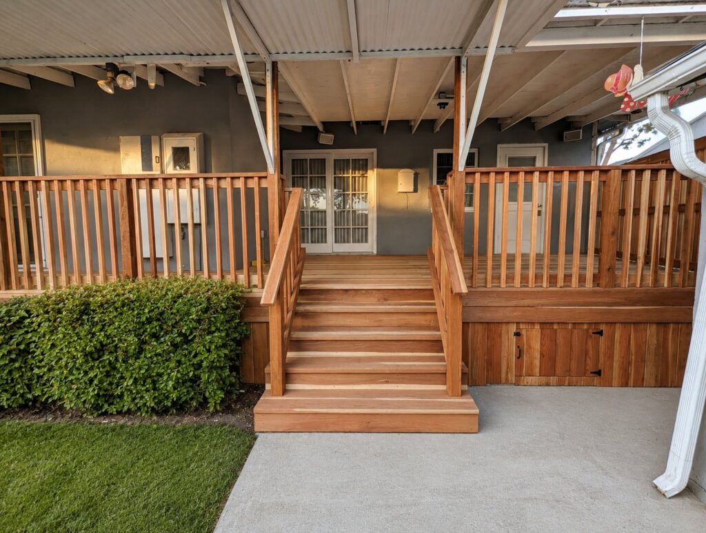 Redwood deck stairs head-on view — full-width treads, closed risers — Los Angeles