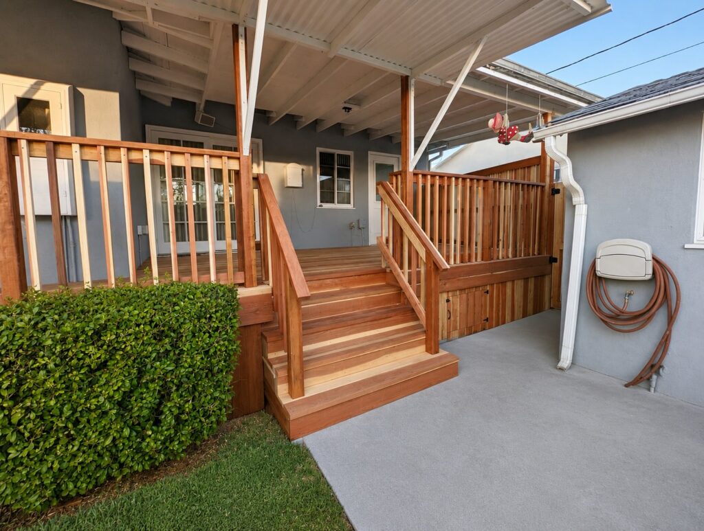 New redwood deck integrated with the existing craftsman bungalow — Los Angeles