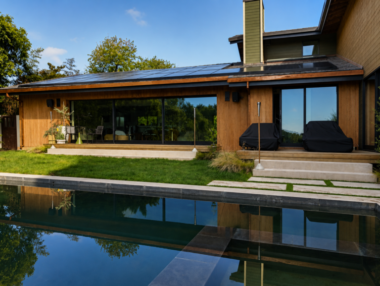 Full-house vertical redwood slat siding modern Los Angeles home with reflecting pool and solar roof — ProHands