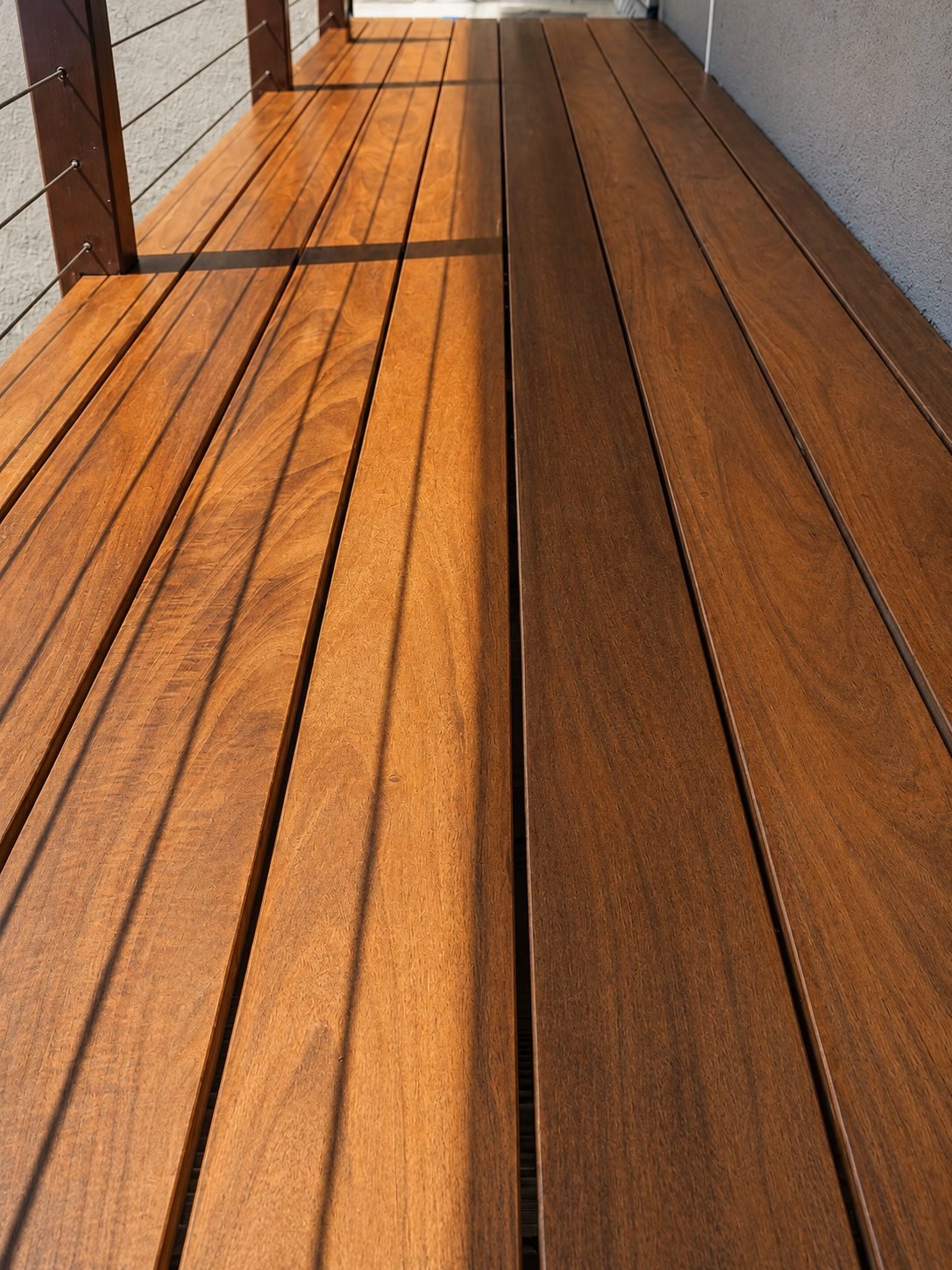 Rich grain of reclaimed ipe hardwood decking after oiling — detail