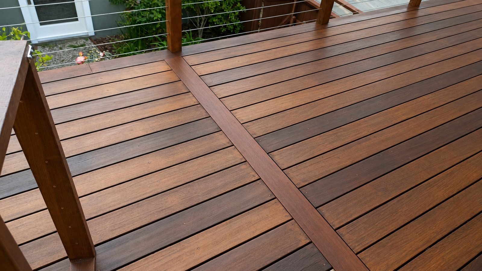 Dark-stained hardwood deck with cable railing — Pasadena