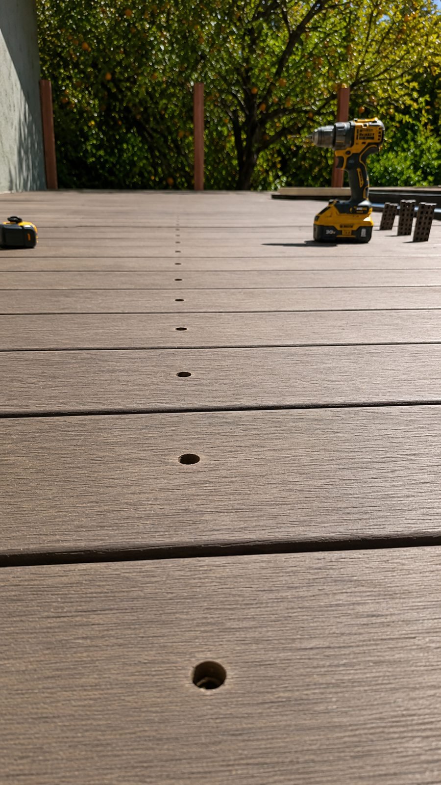 Fastening new deck boards with hidden screws — process shot