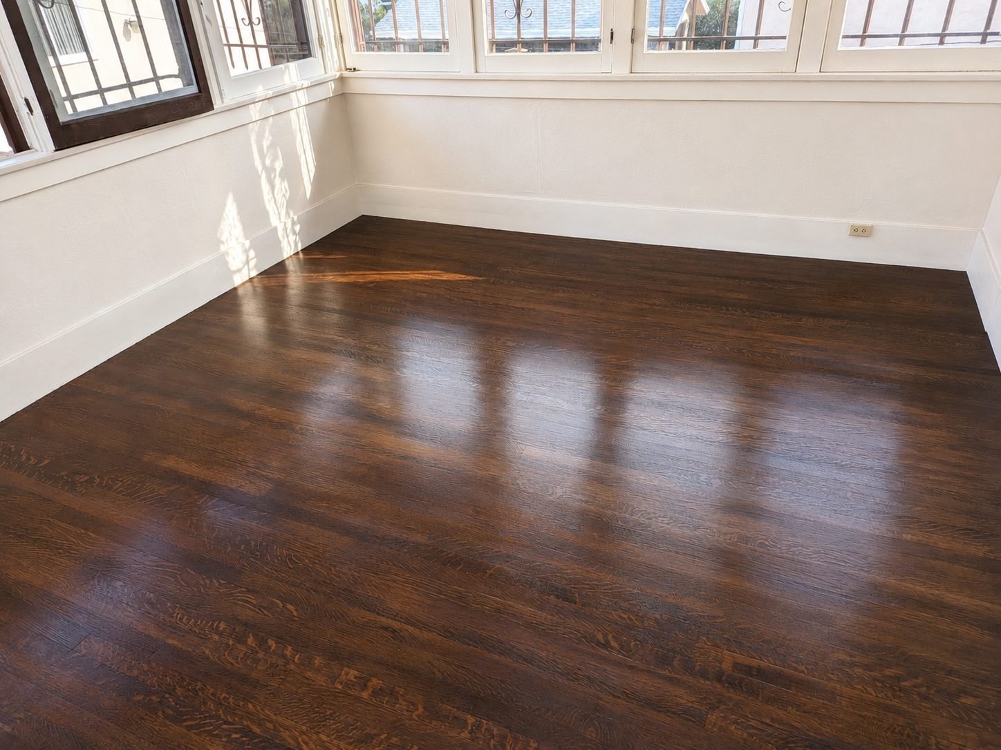 Restored oak parquet floor with durable satin polyurethane finish in Los Angeles — ProHands