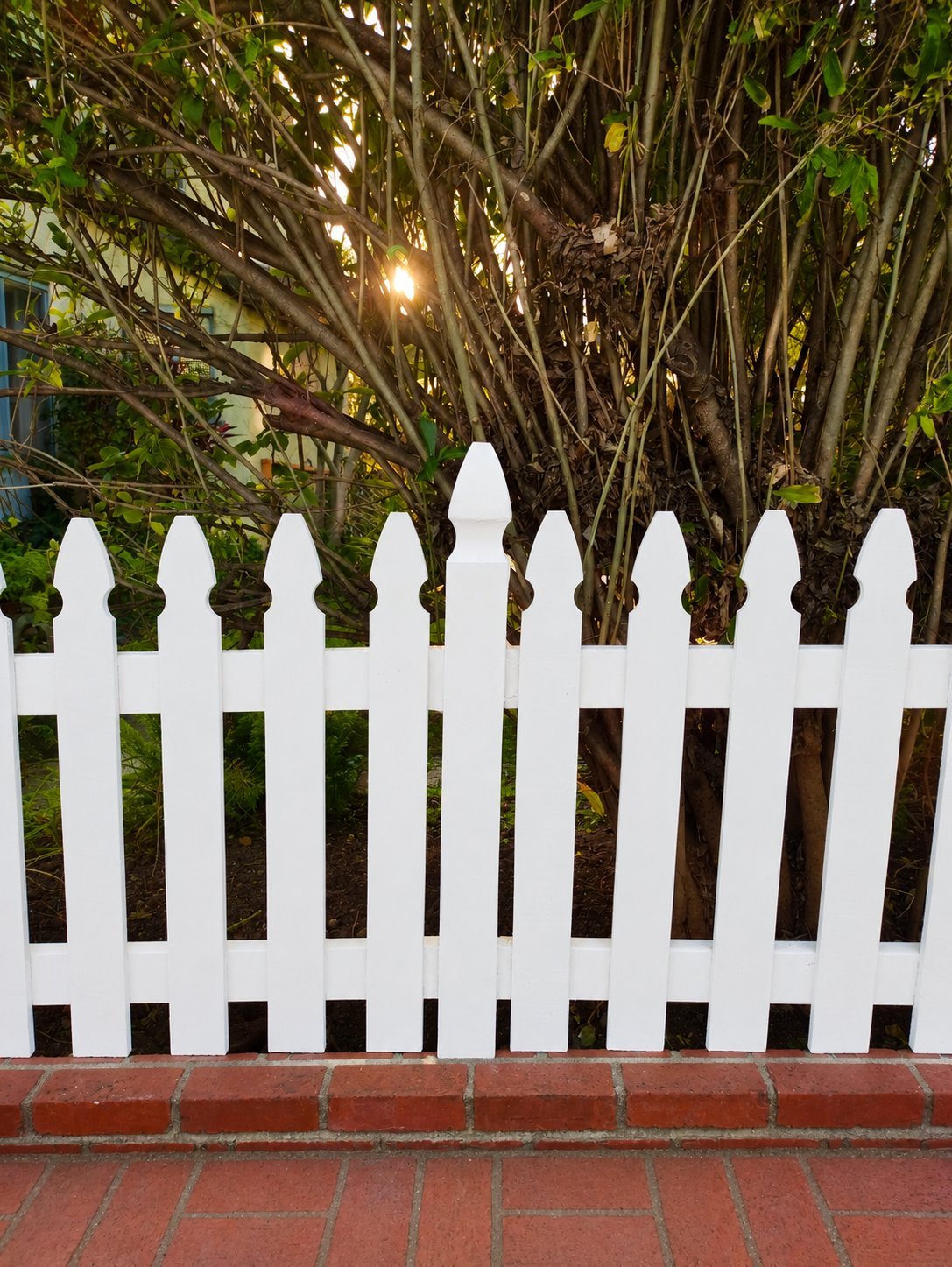 Wood picket fence installation for a Craftsman home in Los Angeles