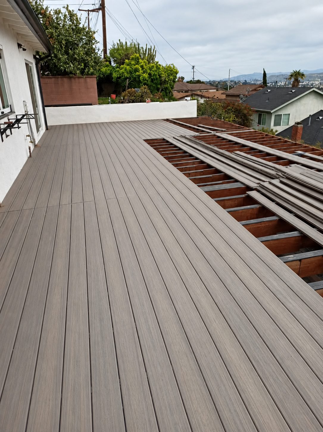 Wood deck edge detail with picture-frame border — ProHands Los Angeles