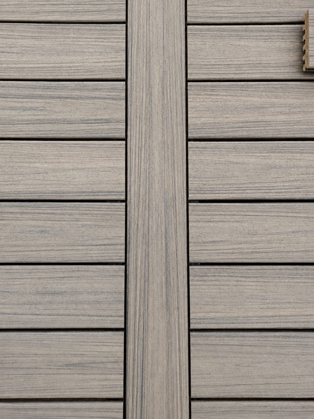 Composite deck detail — picture-frame border with contrasting darker composite board and grey field — ProHands Los Angeles