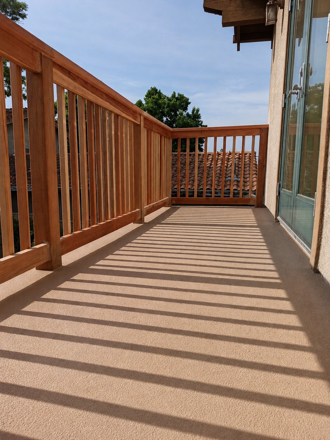 Natural redwood balcony railing on a 2nd-story deck of a Craftsman home — 42