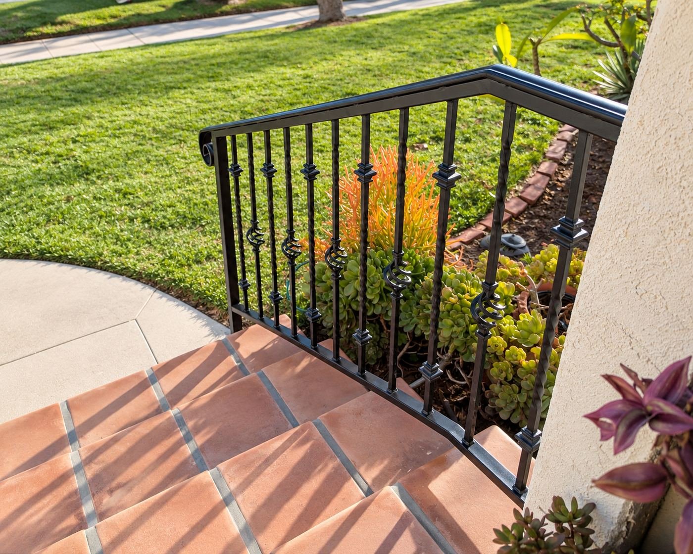 Top-landing view of a new custom wrought-iron handrail we fabricated and installed at a Spanish-style LA home — ProHands